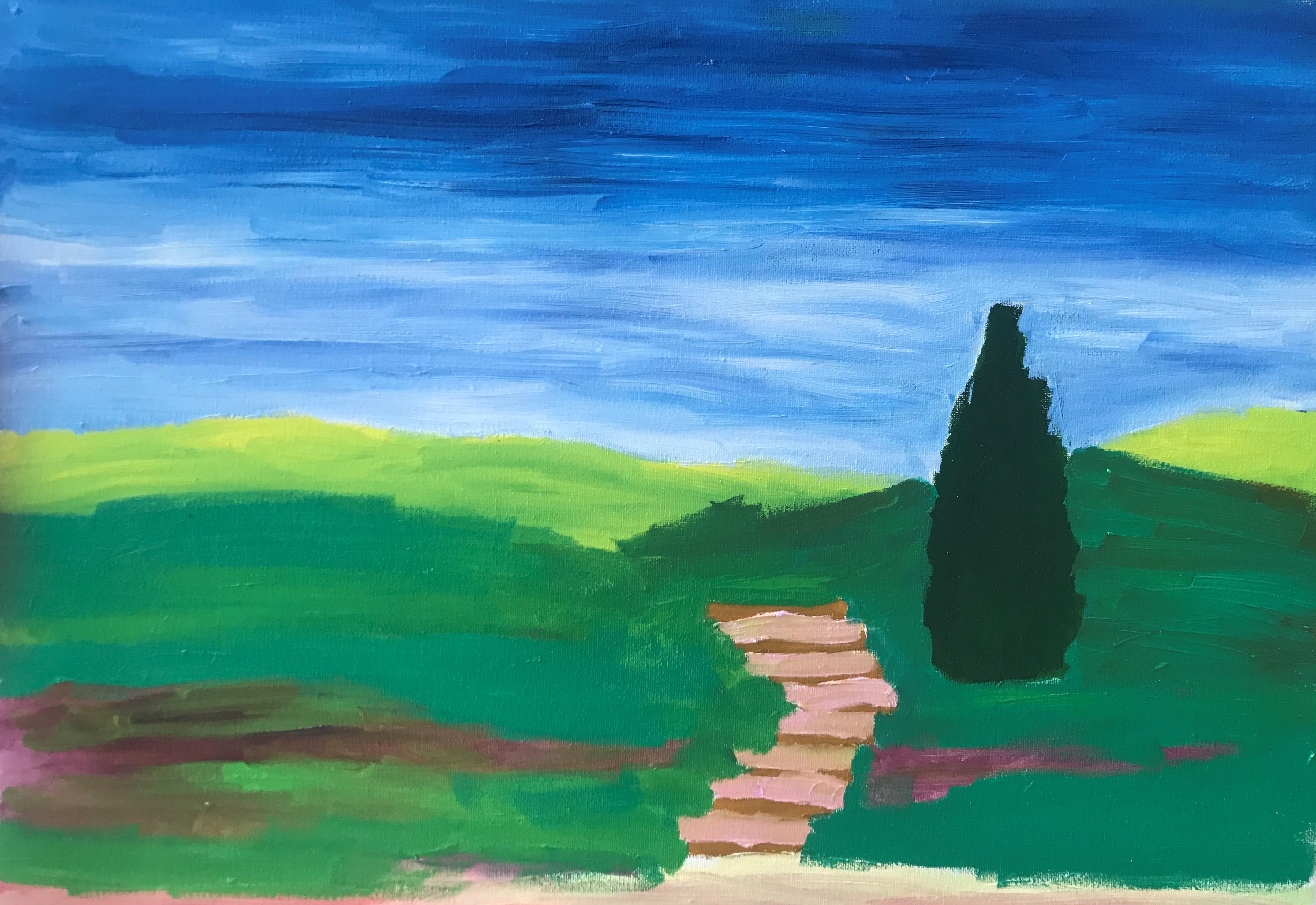 Single metal candleholder with a tall, braided white taper next to a table and chair, casting a prominent shadow on the wa...